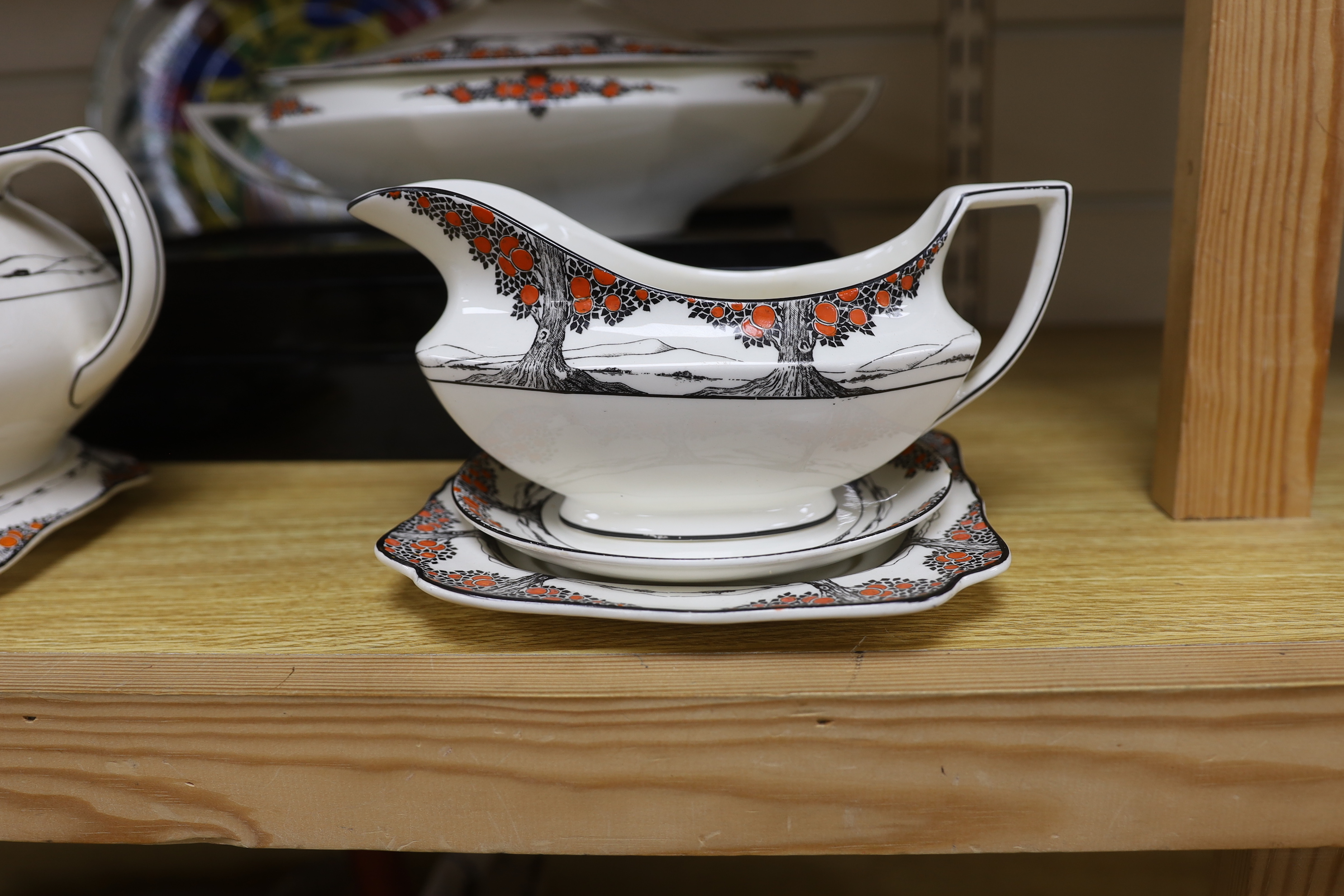 A Crown Ducal orange tree pattern part dinner set including tureens, side plates and jug, together with a Royal Doulton plate, largest 32cm wide